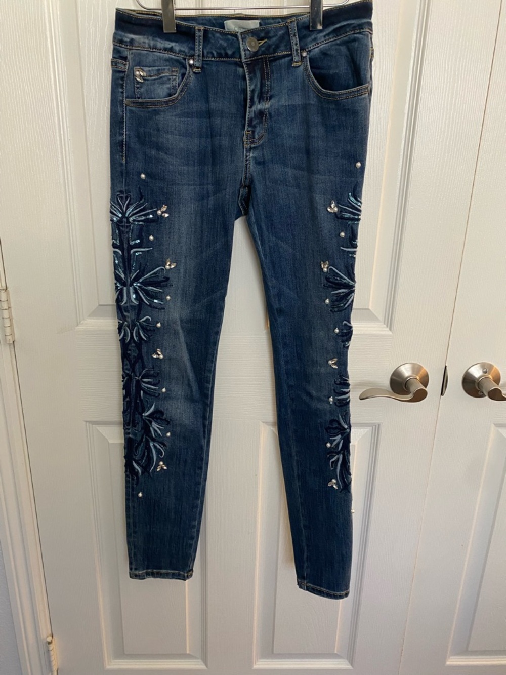 Cartoon Brand Indigo Skinny Jeans with Embroidery and Embellishments.